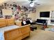 Large bedroom with ceiling fan, a TV, and plenty of space at 319 Celebration Blvd, Celebration, FL 34747