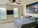 Bedroom featuring two windows and a king bed at 319 Celebration Blvd, Celebration, FL 34747