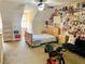 A spacious bedroom with a bed and seating area and natural lighting at 319 Celebration Blvd, Celebration, FL 34747