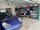 Garage featuring a car, overhead lighting and shelving and space for storage at 319 Celebration Blvd, Celebration, FL 34747