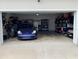 Garage featuring a car, overhead lighting and shelving and space for storage at 319 Celebration Blvd, Celebration, FL 34747