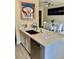 Kitchen sink and island with stainless dishwasher, quartz countertop and adjoining dining area at 319 Celebration Blvd, Celebration, FL 34747
