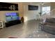 A comfortable living room showcasing a television and a reclining sofa, perfect for relaxing and entertaining at 319 Celebration Blvd, Celebration, FL 34747
