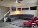 Comfortable living room showcasing a sectional couch, a grey area rug, and Venice-themed wall art at 319 Celebration Blvd, Celebration, FL 34747
