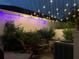 Outdoor patio at night illuminated by festive string lights creating a magical ambiance for evening enjoyment at 319 Celebration Blvd, Celebration, FL 34747