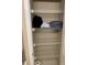 Bathroom shelving with storage space for linens and toiletries at 319 Celebration Blvd, Celebration, FL 34747