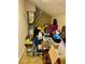 A cluttered storage room with various items piled on top of each other, and an air conditioning unit mounted on the wall at 319 Celebration Blvd, Celebration, FL 34747