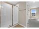 Stylish bathroom featuring a glass-enclosed shower, and access to a walk-in closet at 535 Summit River Dr, Apopka, FL 32712