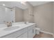 Bright bathroom featuring double sinks, modern fixtures, and a shower with white subway tile at 535 Summit River Dr, Apopka, FL 32712