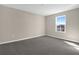 Empty bedroom featuring plush carpeting, neutral walls, and a window offering natural light at 535 Summit River Dr, Apopka, FL 32712