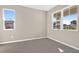 Bright, empty bedroom with tile flooring and two large windows letting in natural light at 535 Summit River Dr, Apopka, FL 32712