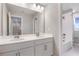 Spacious bathroom with double sinks, white cabinetry, and a separate shower and tub at 2111 Riely Ave, Eagle Lake, FL 33839