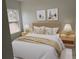 Bedroom with a queen-size bed and light wood nightstands at 6142 Sw 154Th Place Rd, Ocala, FL 34473