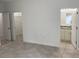 Bedroom with tiled floors, walk-in closet and bathroom access at 6142 Sw 154Th Place Rd, Ocala, FL 34473