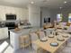 Open concept kitchen with island, dining area, and living room view at 6142 Sw 154Th Place Rd, Ocala, FL 34473