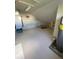 Large unfinished attic area with a water heater and shelving at 62 Coquina Ridge Way, Ormond Beach, FL 32174