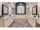 Luxurious bathroom features a soaking tub, dual vanities, and modern fixtures at 62 Coquina Ridge Way, Ormond Beach, FL 32174
