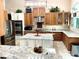 Gourmet kitchen featuring stainless steel appliances, custom cabinetry, and granite countertops at 62 Coquina Ridge Way, Ormond Beach, FL 32174