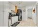 Functional laundry room equipped with washer and dryer, storage cabinets, and countertop space at 62 Coquina Ridge Way, Ormond Beach, FL 32174