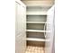 Spacious pantry with multiple shelves offers ample storage at 62 Coquina Ridge Way, Ormond Beach, FL 32174