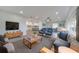 Bright living room with modern furniture, an open floor plan, and lots of natural light at 715 Eastover Cir, Deland, FL 32724