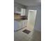 Small kitchen with white cabinets and granite countertop at 7900 S Orange Blossom Trl # 1120, Orlando, FL 32809