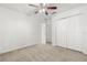 Bright bedroom with ceiling fan and large closet at 1746 Pompano Dr, Poinciana, FL 34759