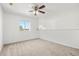 Spacious bedroom with window and ceiling fan at 1746 Pompano Dr, Poinciana, FL 34759