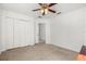 Well-lit bedroom with double door closet and ceiling fan at 1746 Pompano Dr, Poinciana, FL 34759