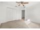 Spacious bedroom with double door closet and ceiling fan at 1746 Pompano Dr, Poinciana, FL 34759