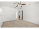 Neutral bedroom with carpeted floors and a ceiling fan, adjoining bathroom at 1746 Pompano Dr, Poinciana, FL 34759
