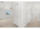Hallway with multiple closets and carpet at 1746 Pompano Dr, Poinciana, FL 34759