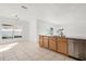 Kitchen with light wood cabinets, granite counters, and stainless steel appliances at 1746 Pompano Dr, Poinciana, FL 34759