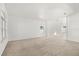 Open living room with neutral carpeting and large windows at 1746 Pompano Dr, Poinciana, FL 34759