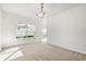 Living Room showcasing natural light with carpeted floors at 1746 Pompano Dr, Poinciana, FL 34759