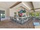 Community bar with ample seating, TVs, and an open-air setting overlooking greenery at 9099 Hazard St, Davenport, FL 33896