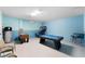 Game room features a pool table, foosball table, basketball game, and a mini bar at 9099 Hazard St, Davenport, FL 33896