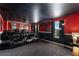 Home theater featuring tiered seating, a projector and movie posters at 9099 Hazard St, Davenport, FL 33896