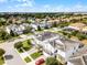 A lovely aerial view of a neighborhood showcasing well-maintained homes, lush landscaping, and inviting curb appeal at 9099 Hazard St, Davenport, FL 33896