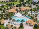 Resort-style pool area offering a luxurious and relaxing retreat with many palm trees and plenty of seating at 9099 Hazard St, Davenport, FL 33896