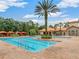 Inviting outdoor pool surrounded by ample seating and lush landscaping offering a perfect space for recreation and relaxation at 9099 Hazard St, Davenport, FL 33896