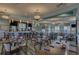 This restaurant features tables, chairs, a bar, and large windows to enjoy the view at 9099 Hazard St, Davenport, FL 33896