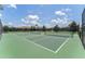 Outdoor tennis courts with nets and fencing available for residents to practice their tennis skills at 9099 Hazard St, Davenport, FL 33896