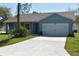 Charming single-Gathering home featuring a two-car garage, well-maintained lawn, and inviting curb appeal at 106 Sparrow Ct, Kissimmee, FL 34759