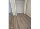 This bedroom features an empty closet and modern, grey vinyl floors at 1325 Dunbarton Ct, Kissimmee, FL 34758