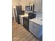Kitchen featuring a sleek black appliance package and gray cabinets at 1325 Dunbarton Ct, Kissimmee, FL 34758