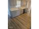 Charming kitchen features stainless steel appliances and gray cabinets at 1325 Dunbarton Ct, Kissimmee, FL 34758
