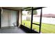 Enclosed patio with seating offering views of the expansive, fenced backyard, perfect for outdoor living at 449 Ball Ct, Kissimmee, FL 34759