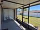 Relaxing screened patio features a seating area and views of the well-maintained, fenced backyard at 449 Ball Ct, Kissimmee, FL 34759