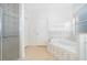 A bright bathroom features a tub, shower and tiled floors at 2507 Monaco Cove Cir, Orlando, FL 32825